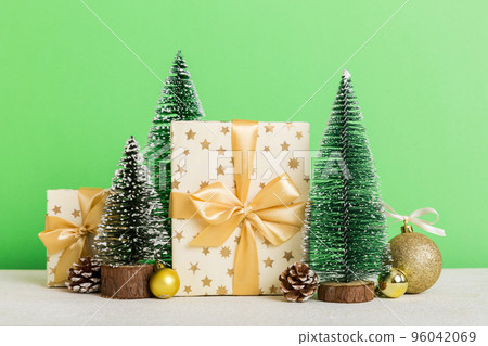 Christmas composition. craft Gift box, small tree, branches and craft DIY decorations on white background. New year concept. Christmas home decoration Flat lay, top view, copy space Christmas composition. craft Gift box, small tree, branches and craft DIY decorations on white background. New year concept. Christmas home decoration Flat lay, top view, copy space 96042069