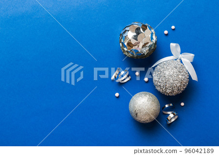 Christmas ball on colored background. decoration bauble with ribbon bow with copy space 96042189
