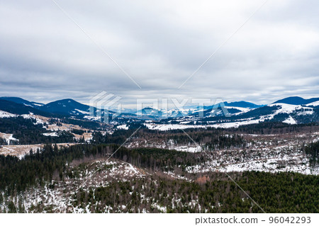 Carpathian slopes in the snow, view of the mountains from above, panorama from a drone. 96042293