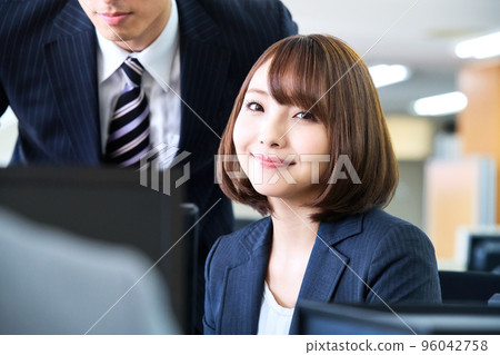 Young business woman in a suit having a meeting in the office 96042758