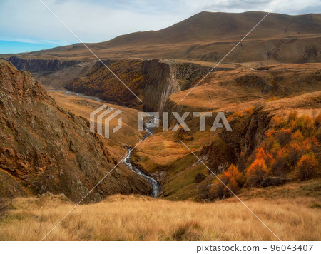 Autumn mountains in misty morning. Gil-Su valley in North Caucasus, Russia. Beautiful autumn landscape Autumn mountains in misty morning. Gil-Su valley in North Caucasus, Russia. Beautiful autumn landscape 96043407