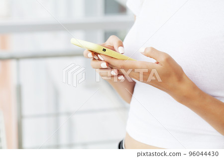 Phone dependence, a young woman chats around the clock on social networks Phone dependence, a young woman chats around the clock on social networks 96044430