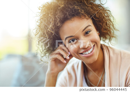 Home is a place to be happy. Portrait of a happy young woman at home. Home is a place to be happy. Portrait of a happy young woman at home. 96044445