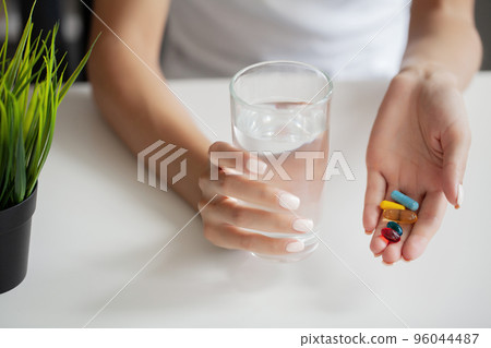 Beautiful Smiling Woman Taking Vitamin Pill, Dietary Supplement 96044487