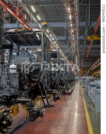 Tractor assembly line in a production building, Tractor cabs in the assembly hall Tractor assembly line in a production building, Tractor cabs in the assembly hall 96044922