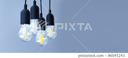 light bulbs located on the wires. Design concept in minimalist style 96045243