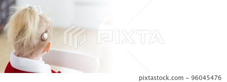 Banner deaf child girl with cochlear implant on living room - deafness diversity and innovative hearing aid medical technologies 96045476