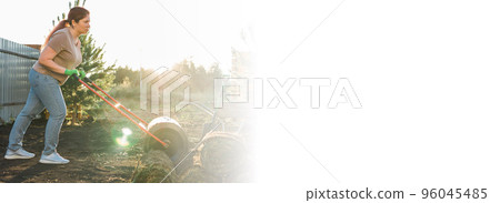 Banner woman laying sod for new garden lawn copy space - turf laying concept 96045485