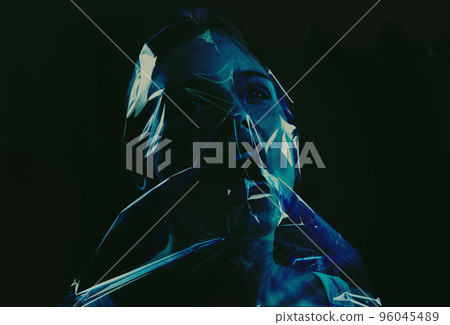 Taking her last breath. A young woman suffocating with her head wrapped in plastic while isolated on a black background. Taking her last breath. A young woman suffocating with her head wrapped in plastic while isolated on a black background. 96045489