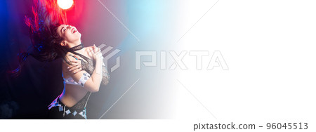 Banner young woman belly dancer in exotic dress with gold, dancing tribal fusion dance in studio copy space Banner young woman belly dancer in exotic dress with gold, dancing tribal fusion dance in studio copy space 96045513