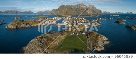 Incredible aerial view of Henningsvaer, football field and mountains in the background. 96045889