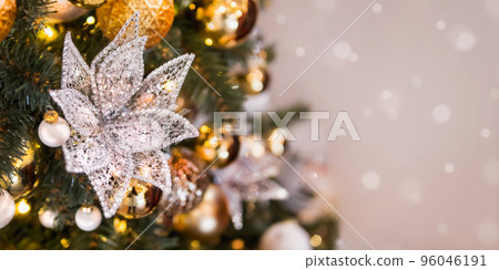 Christmas tree with shiny decorations. Fir tree decorated with light bulbs, lace flower and golden balls for New Year celebration. Christmas tree with shiny decorations. Fir tree decorated with light bulbs, lace flower and golden balls for New Year celebration. 96046191