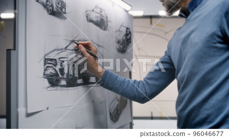 Designers working in car design studio Designers working in car design studio 96046677