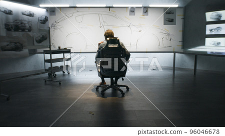 Male designer looking at future car sketch Male designer looking at future car sketch 96046678