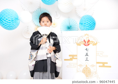 A 5-year-old Japanese boy taking a commemorative photo wearing a hakama at Shichigosan A 5-year-old Japanese boy taking a commemorative photo wearing a hakama at Shichigosan 96047445