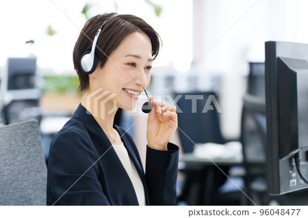 A woman working at a call center A woman working at a call center 96048477