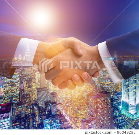 Businessman shaking hands in agreement 96049283
