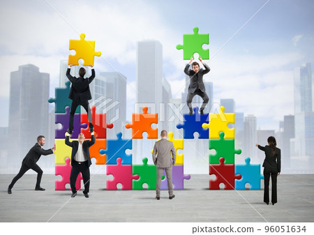 Team of businesspeople build a new company Team of businesspeople build a new company 96051634