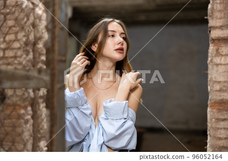Portrait of young desirable woman in abandoned building Portrait of young desirable woman in abandoned building 96052164
