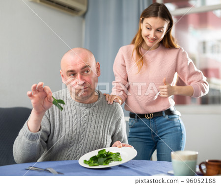 Man dissatisfied by dinner made by his wife 96052188