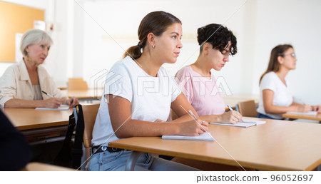 Young woman learning language in classroom Young woman learning language in classroom 96052697
