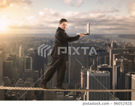 Equilibrist businessman Equilibrist businessman 96052928