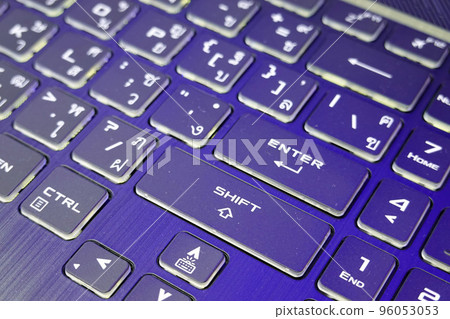 Close up of English-Thai language black computer keyboard with rgb colors.      96053053