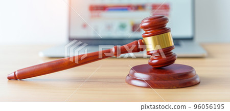 judge gavel and laptop computer for online shopping on desk. online auction and bidding, Consumer protection law,  lawyer, tax,  justice and judgment concept 96056195