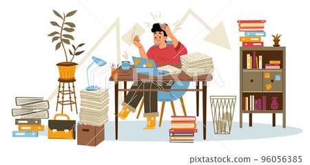 Distressed young man sitting at desk with laptop 96056385