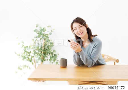 A woman with a cell phone A woman with a cell phone 96056472