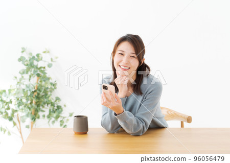 A woman with a cell phone A woman with a cell phone 96056479