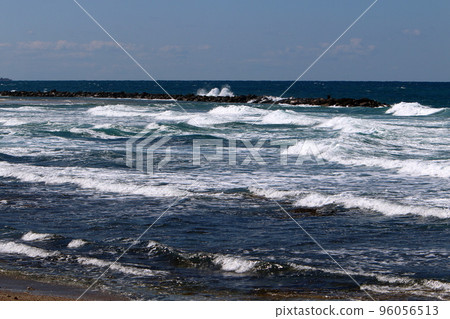 Breakwater on the city beach to protect the coastline from strong waves. 96056513