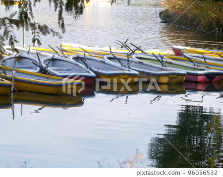 Boat floating on the pond in the park Boat floating on the pond in the park 96056532