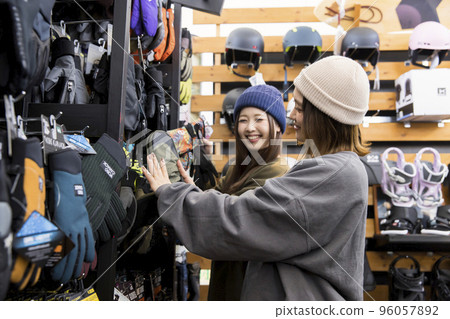 Young woman shopping in a sports shop 96057892