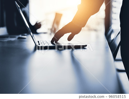 Success requires the use of smart resources. Silhouetted shot of an unrecognizable businessman using a laptop in an office. Success requires the use of smart resources. Silhouetted shot of an unrecognizable businessman using a laptop in an office. 96058515