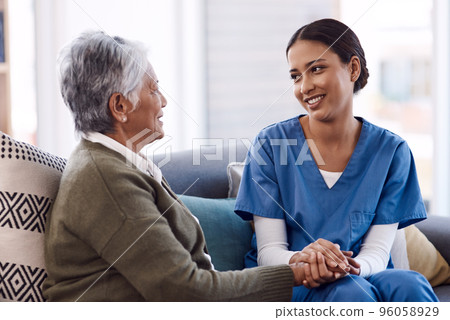 Im here to lend my support whenever you need. Shot of a young nurse chatting to a senior woman in a retirement home. Im here to lend my support whenever you need. Shot of a young nurse chatting to a senior woman in a retirement home. 96058929