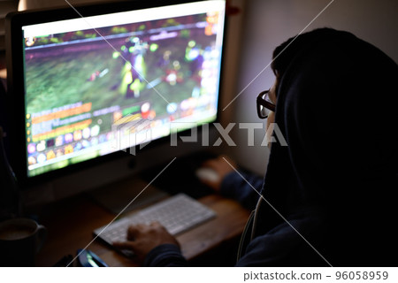 Working on a new game. Cropped shot of a young programmer focused on his work. 96058959
