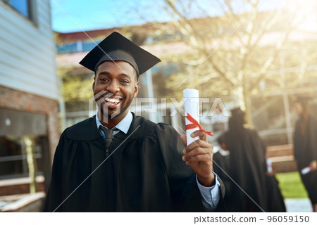 My success story starts here. Portrait of a happy young man holding a diploma on graduation day. 96059150