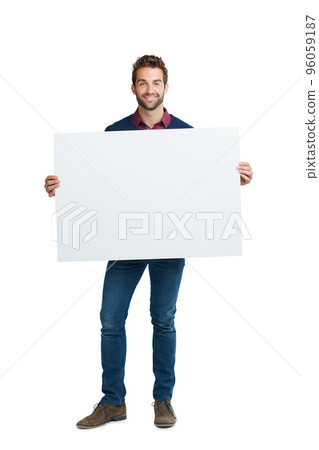 Copyspace for your customization. Studio portrait of a handsome man holding a blank placard against a white background. 96059187