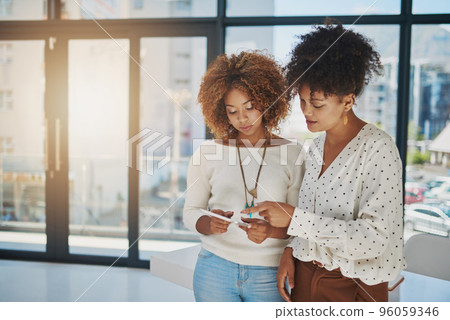 Designers of success. Shot of creative employees working in a office. Designers of success. Shot of creative employees working in a office. 96059346