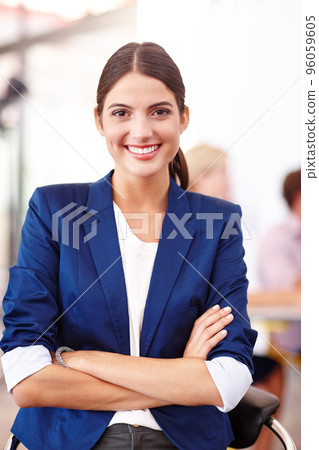 Success has been good to me. Cropped portrait of an attractive young businesswoman standing in her office. Success has been good to me. Cropped portrait of an attractive young businesswoman standing in her office. 96059605