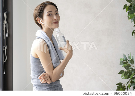 Woman resting after training hydration workout Woman resting after training hydration workout 96060054