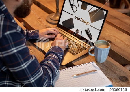 Cropped image of a young man working on his laptop in a coffee shop, rear view of business man hands busy using laptop at office desk, young male student texting on computer sitting at wooden table. 96060136
