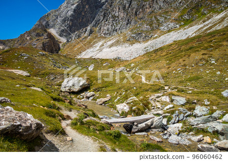 Mountain river and wood bridge in Vanoise national Park valley, French alps 96060462