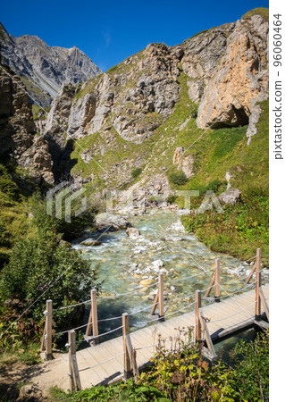 Mountain river and wood bridge in Vanoise national Park valley, French alps 96060464