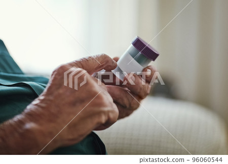 Whats this one for now again. Cropped shot of a senior man about to take his medication. 96060544