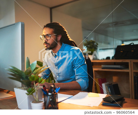 You need a tireless work ethnic to reach success. Cropped shot of a young designer working late on a computer in an office. You need a tireless work ethnic to reach success. Cropped shot of a young designer working late on a computer in an office. 96060564