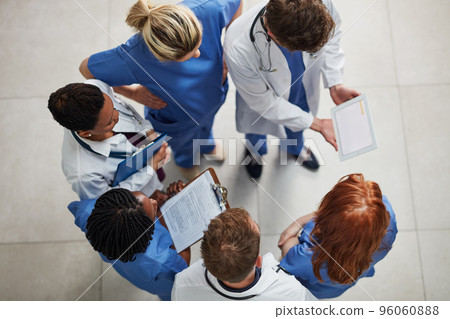 Monitoring the health of their patients. High angle shot of a group of medical practitioners working together in a hospital. 96060888