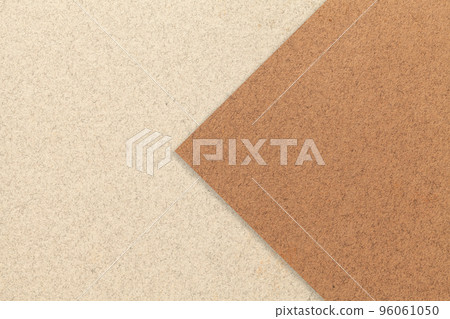 Texture of light beige paper background, half two colors with brown arrow. Structure of sand craft cardboard. 96061050