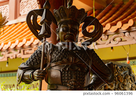 A guard at the entrance to the temple. 96061396